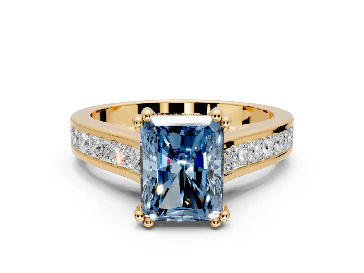 Solitaire Engagement Ring Setting for Fancy Blue Radiant Cut Center with Channel Band and Double Claw Prong Head in Yellow Gold