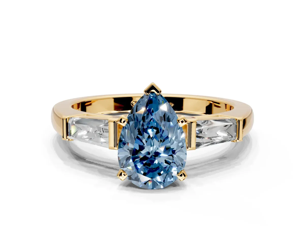3 Stone Engagement Ring Setting for Fancy Blue Pear-Shaped Center with Tapered Baguettes, Plain Band and Prong Head in Yellow Gold