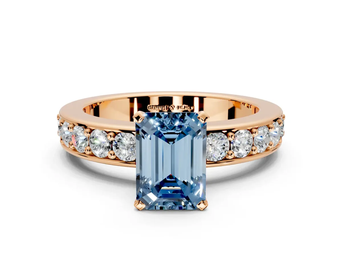 Solitaire Engagement Ring Setting for Fancy Blue Emerald Cut Center with Channel-Set Accents and Prong Head in Rose Gold