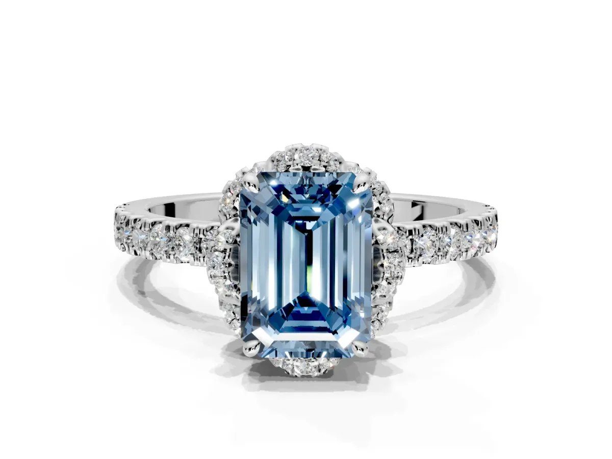 Halo Engagement Ring Setting for Fancy Blue Emerald Cut Center with Openwork Halo, Pave Band and Prong Head in Platinum