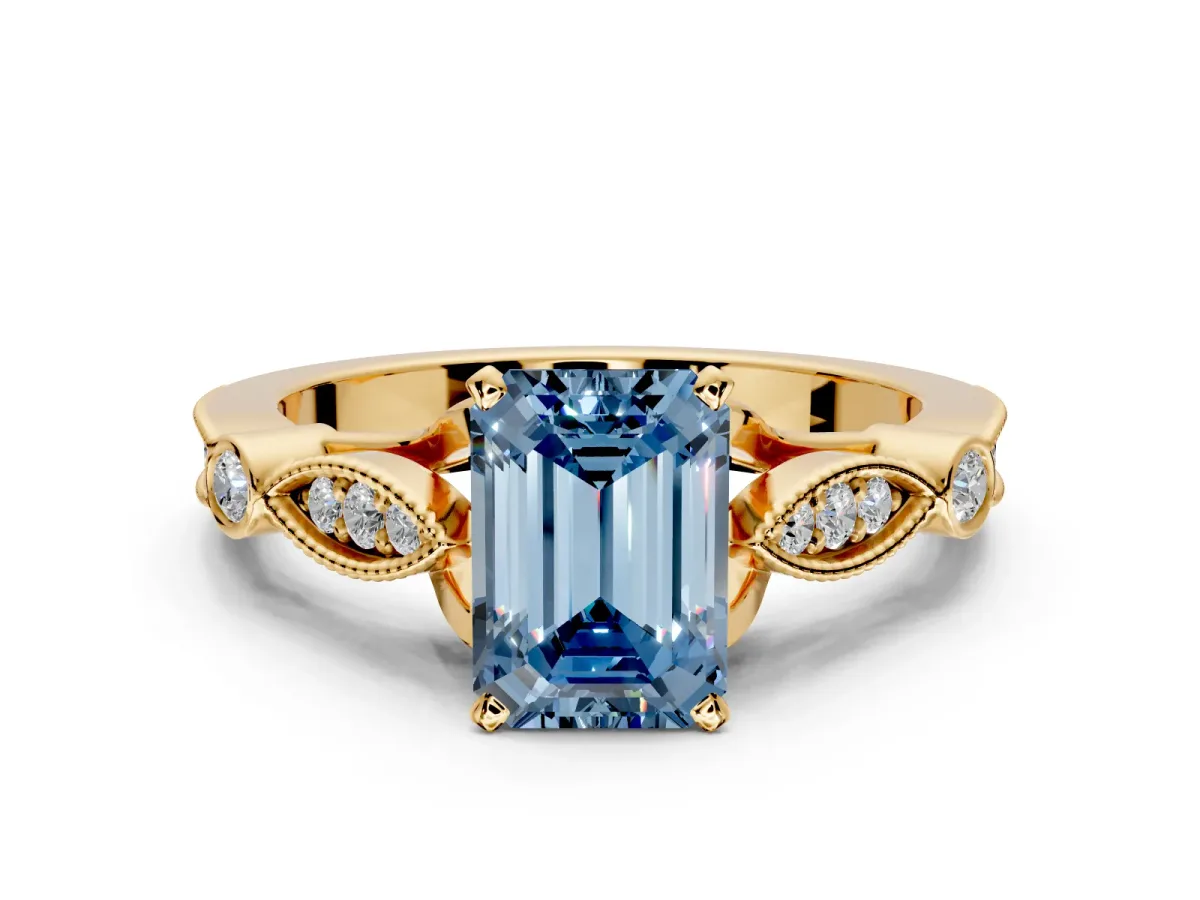 Solitaire Engagement Ring Setting for Fancy Blue Emerald Cut Center with Marquise and Bezel Accents and Prong Head in Yellow Gold