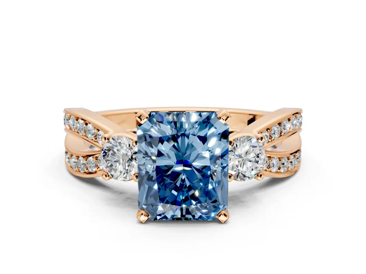 3 Stone Engagement Ring Setting for Fancy Blue Radiant Cut Center with Pave Twist Band and Prong Head in Rose Gold