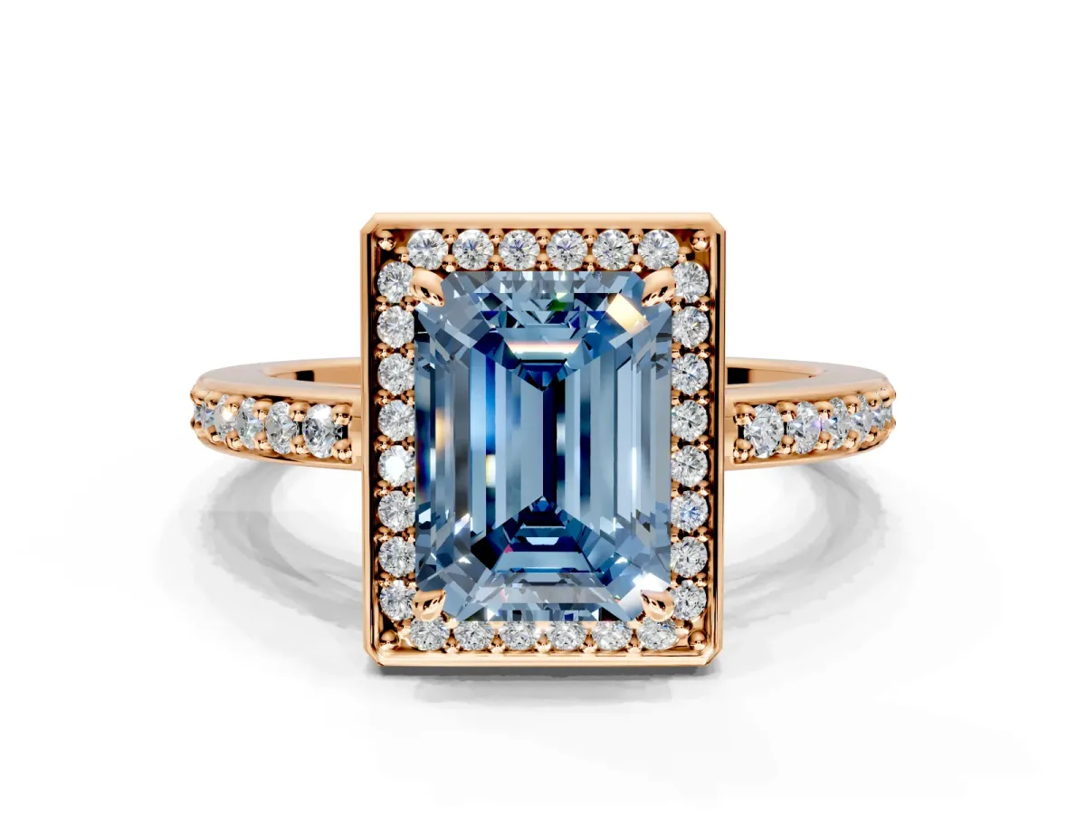 Halo Engagement Ring Setting for Fancy Blue Emerald Cut Center with Metal-Rimmed Halo, Pave Band and Prong Head in Rose Gold