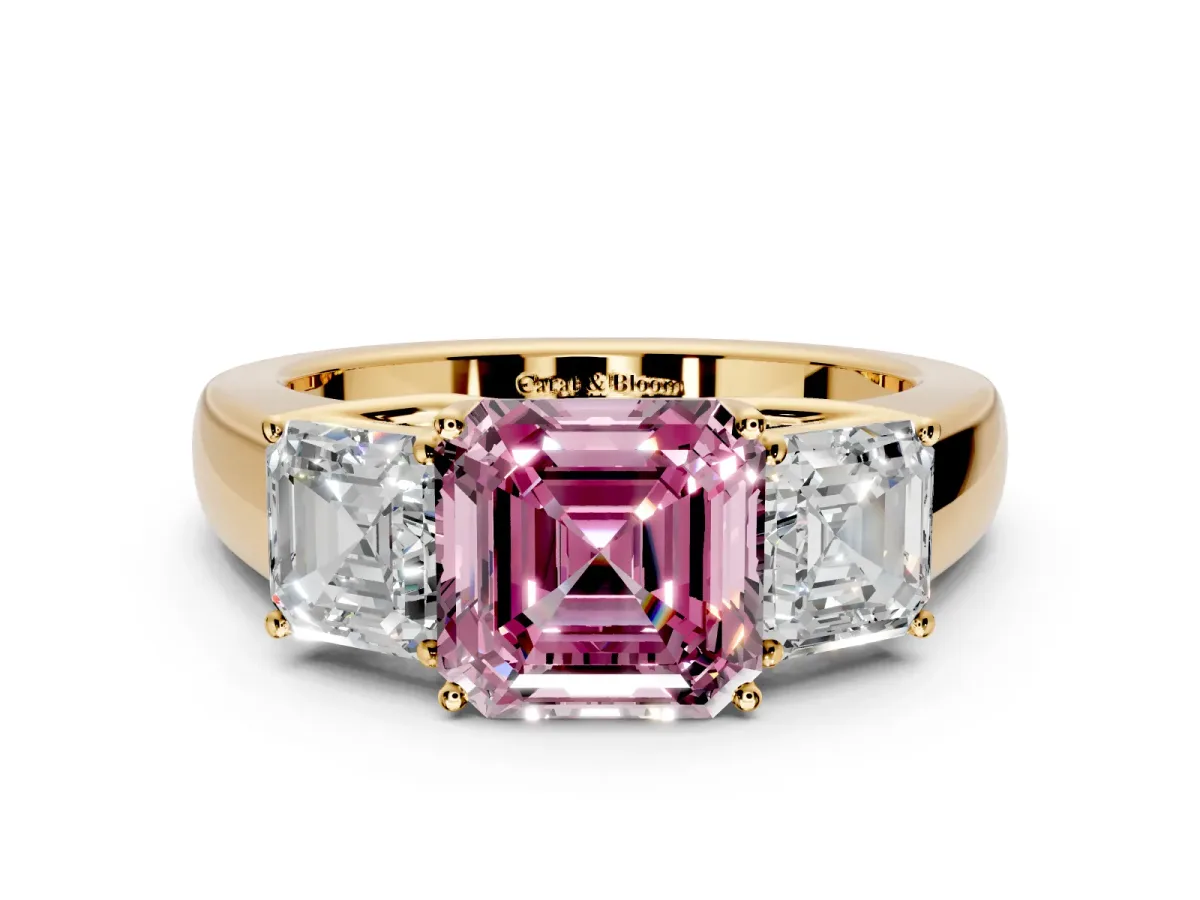 3 Stone Engagement Ring Setting for Fancy Pink Asscher Cut Center with Raised Basket Heads and Prong Head in Yellow Gold