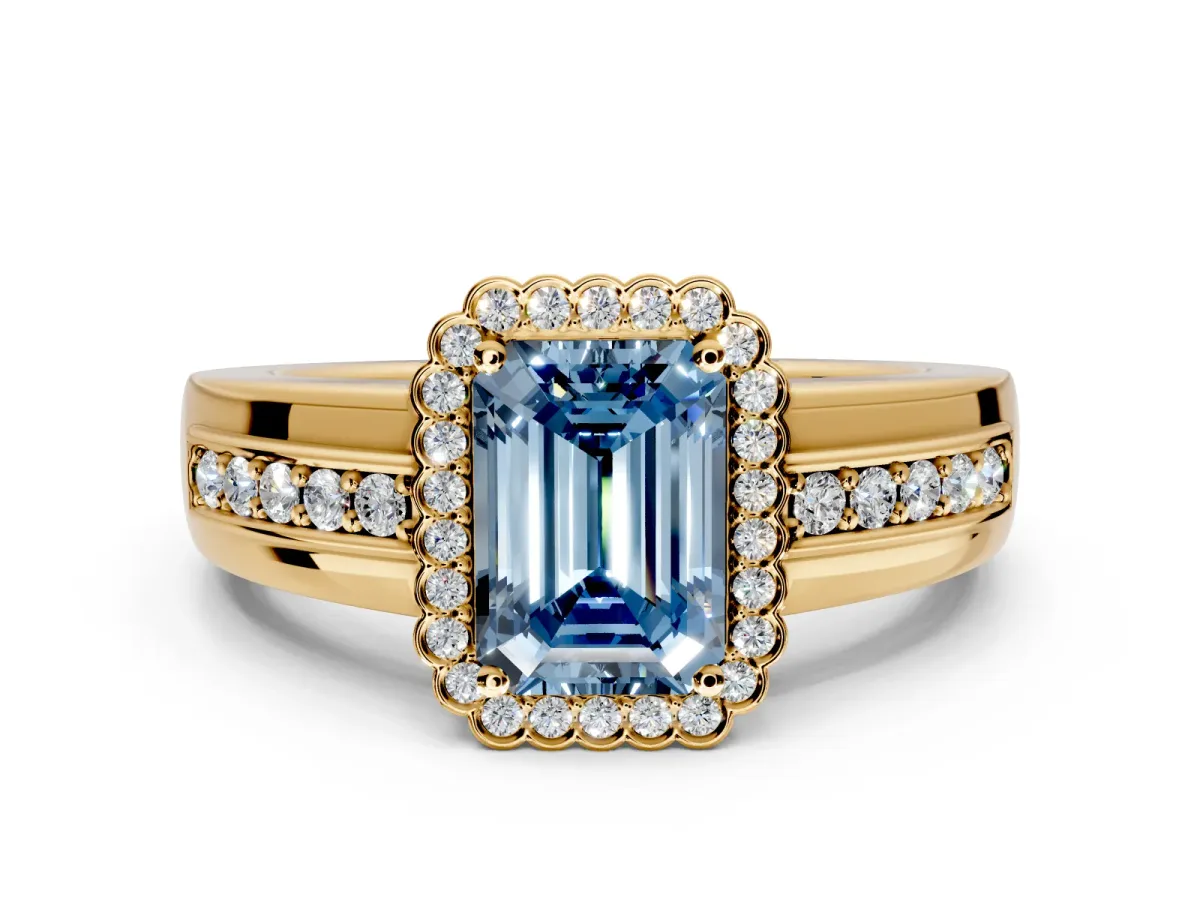 Halo Engagement Ring Setting for Fancy Blue Emerald Cut Center with Wide Band, Inlaid Accent Row and Prong Head in Yellow Gold