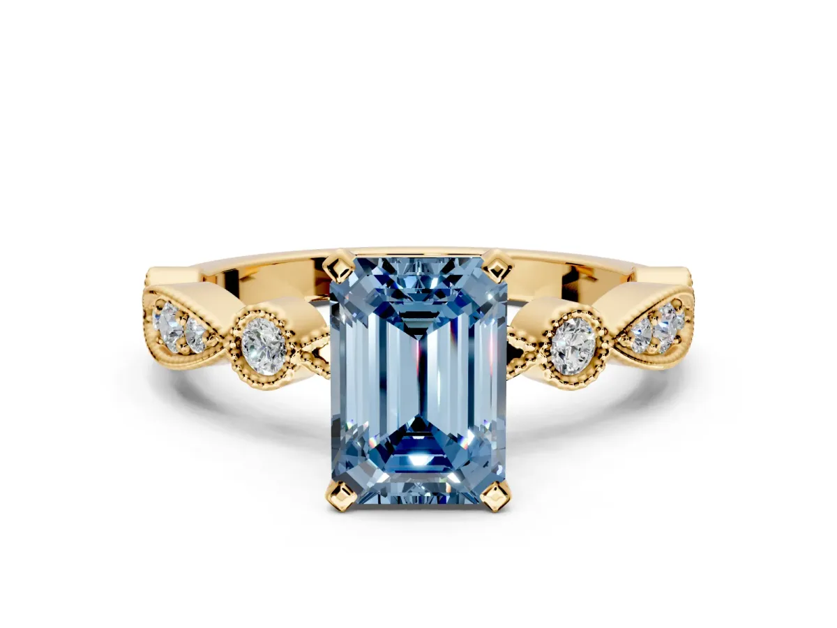 Solitaire Engagement Ring Setting for Fancy Blue Emerald Cut Center with Milgrain Bezel Accents and Prong Head in Yellow Gold