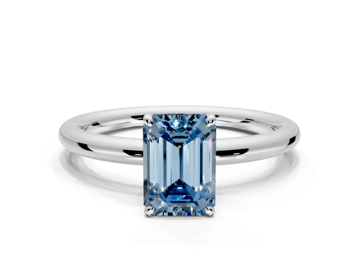 Low-Set Solitaire Engagement Ring Setting for Fancy Blue Emerald Cut Center with Thin Plain Band and Prong Head in Sterling Silver