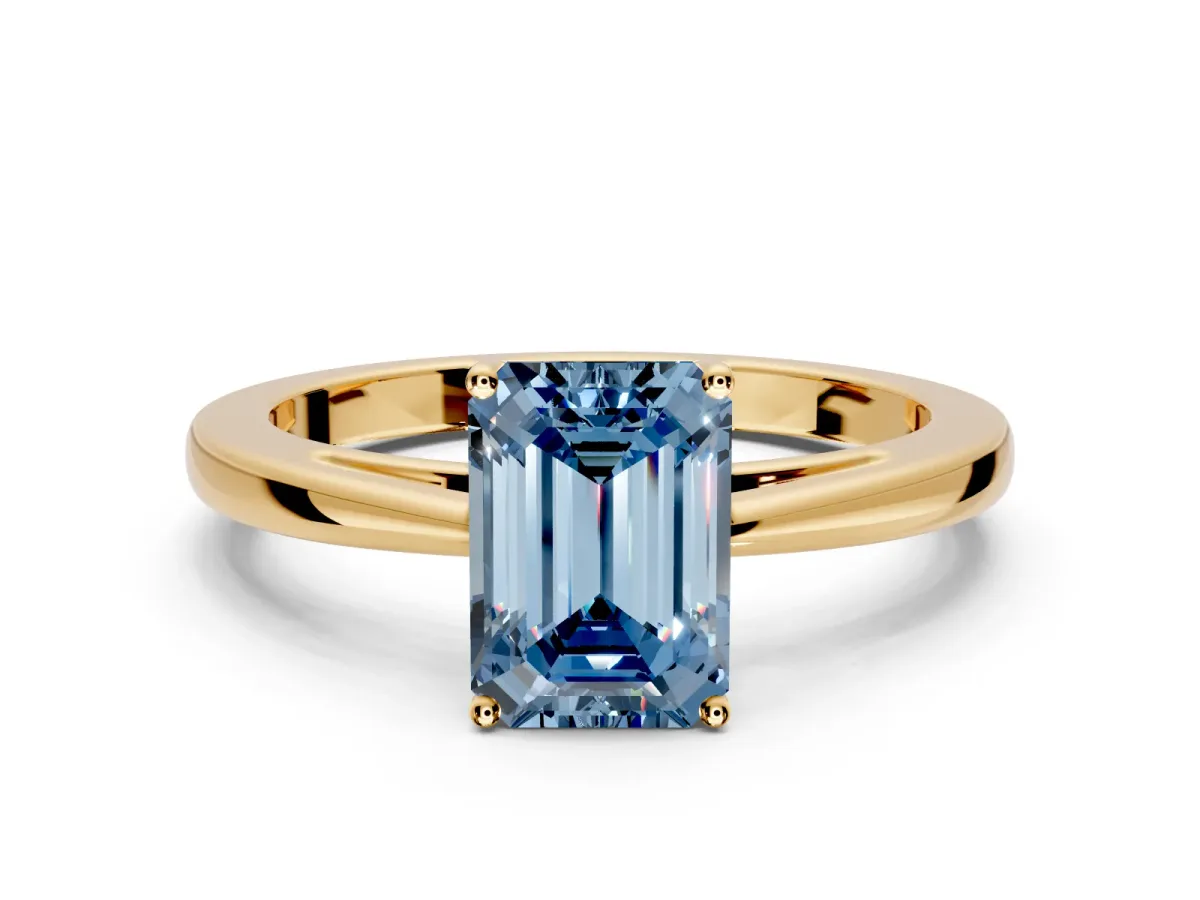 Solitaire Engagement Ring Setting for Fancy Blue Emerald Cut Center with Open Cathedral Shoulders and Prong Head in Yellow Gold