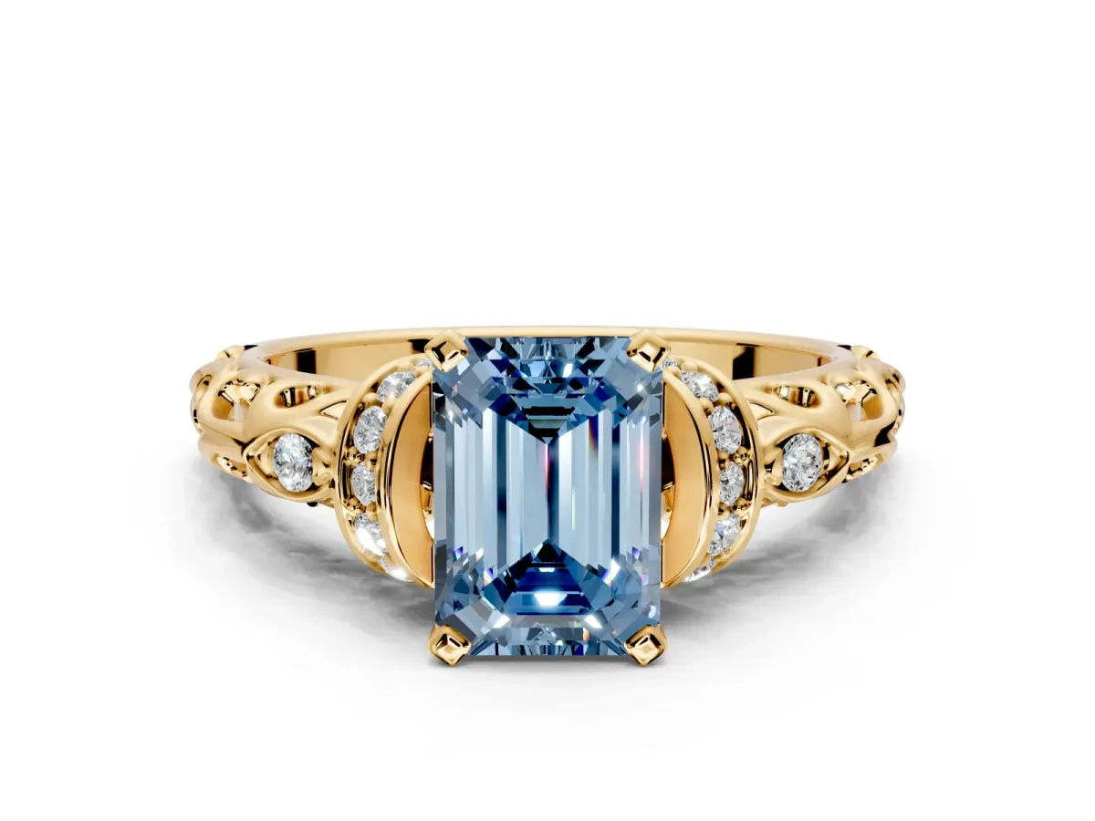 Solitaire Engagement Ring Setting for Fancy Blue Emerald Cut Center with Filigree Band and Prong Head in Yellow Gold