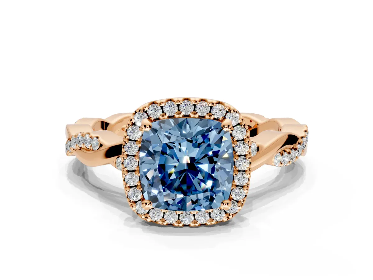 Halo Engagement Ring Setting for Fancy Blue Cushion Cut Center with Pave and Plain Twist Band and Prong Head in Rose Gold