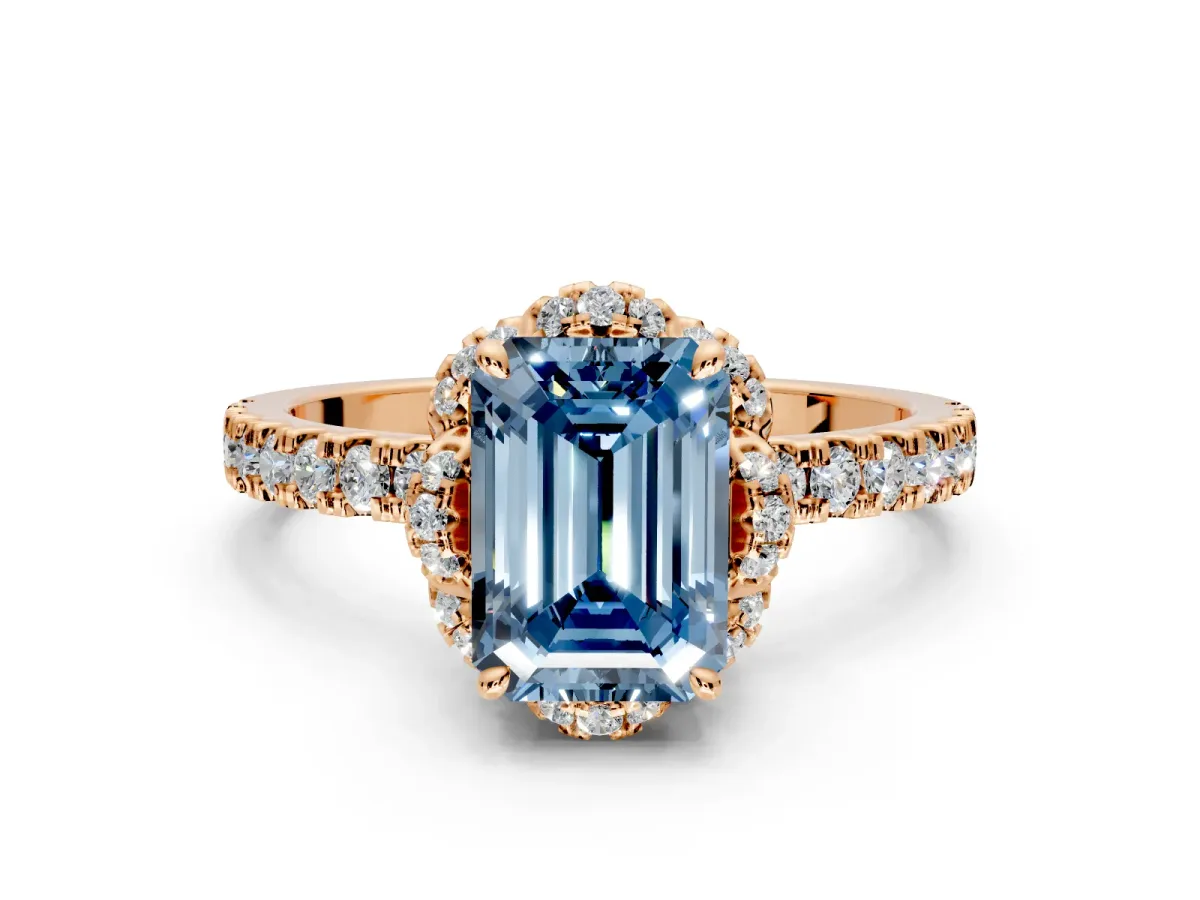 Halo Engagement Ring Setting for Fancy Blue Emerald Cut Center with Openwork Halo, Pave Band and Prong Head in Rose Gold