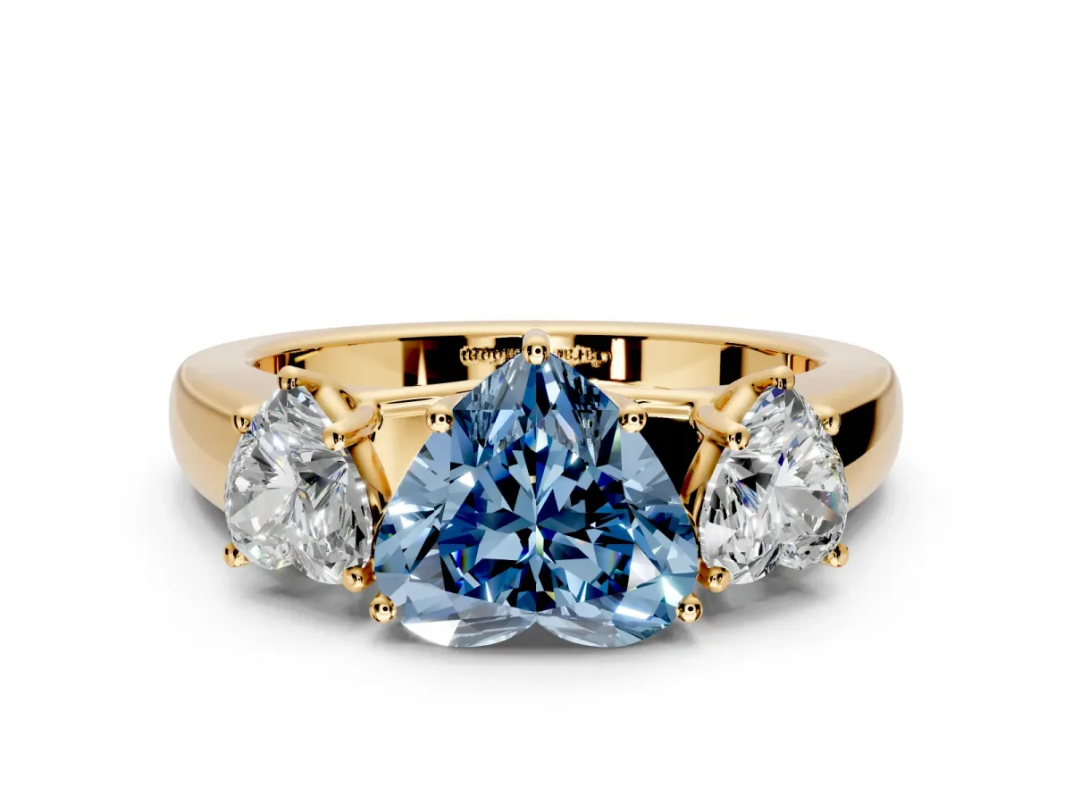 3 Stone Engagement Ring Setting for Fancy Blue Heart-Shaped Center with Raised Basket Heads and Prong Head in Yellow Gold