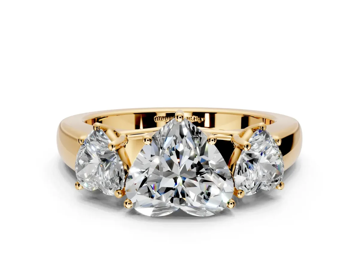3 Stone Engagement Ring Setting for Heart-Shaped Center with Raised Basket Heads and Prong Head in Yellow Gold