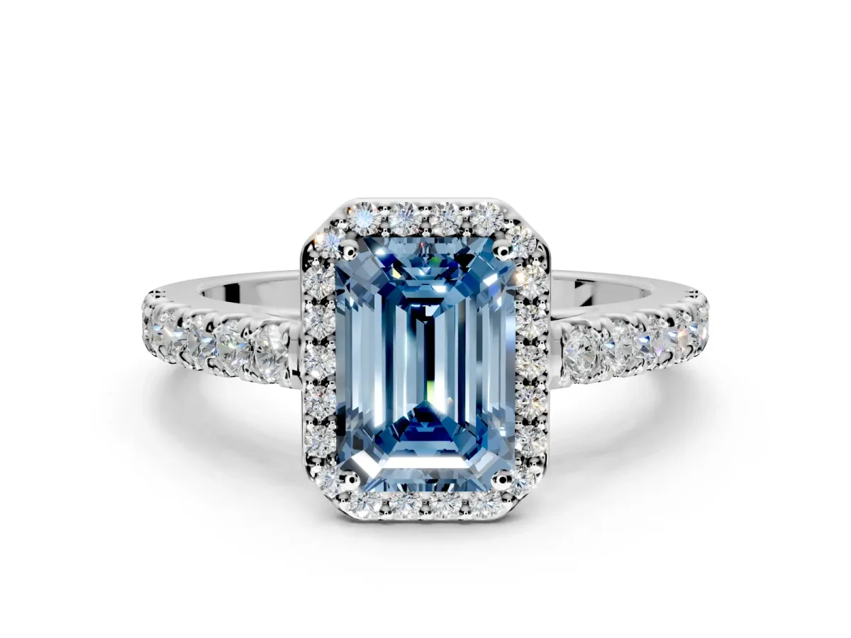 Halo Engagement Ring Setting for Fancy Blue Emerald Cut Center with Full Pave Band and Prong Head in Platinum