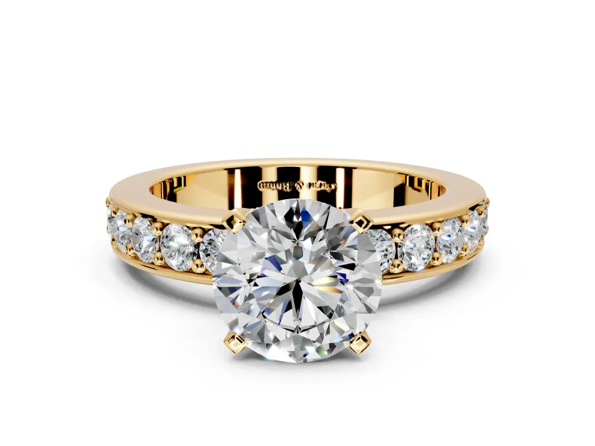 Solitaire Engagement Ring Setting for Round Cut Center with Channel-Set Accents and Prong Head in Yellow Gold