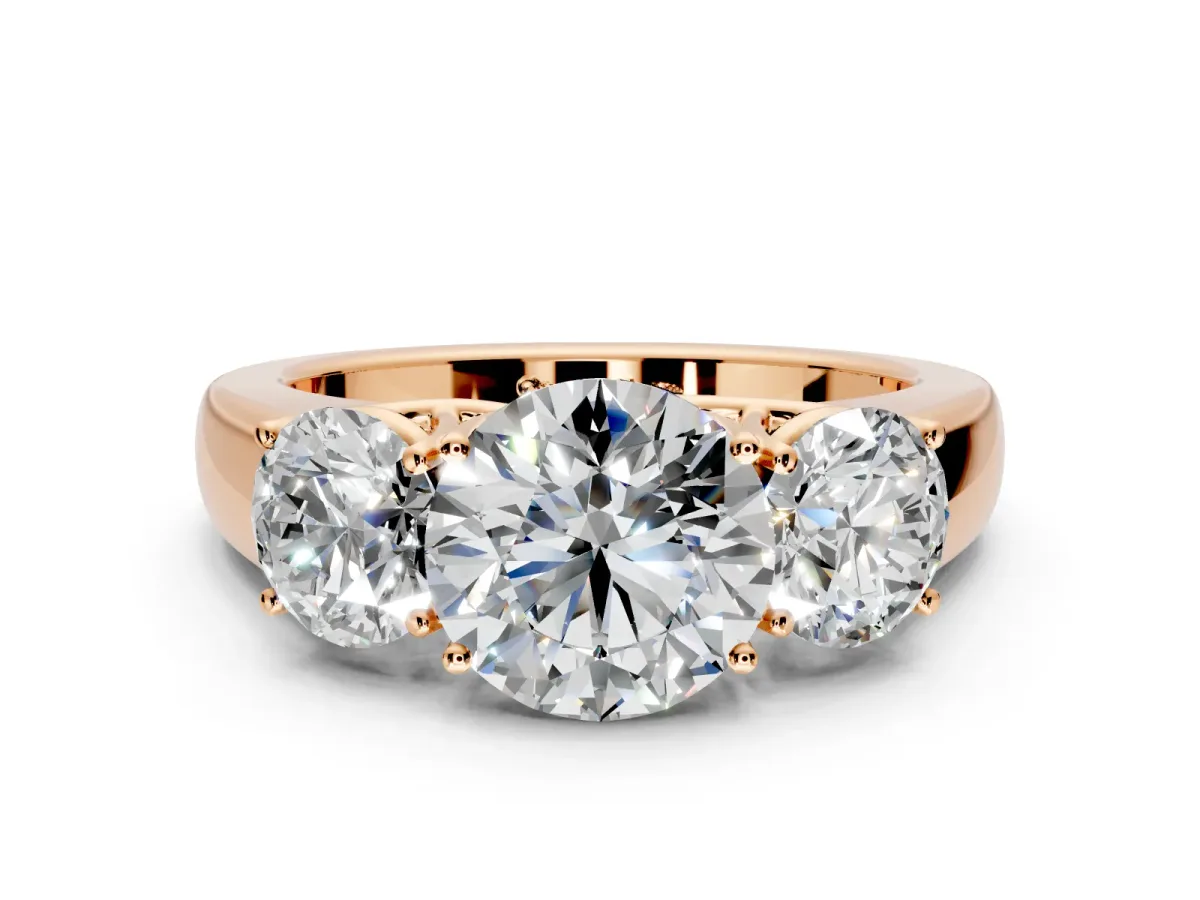 3 Stone Engagement Ring Setting for Round Cut Center with Raised Basket Heads and Prong Head in Rose Gold