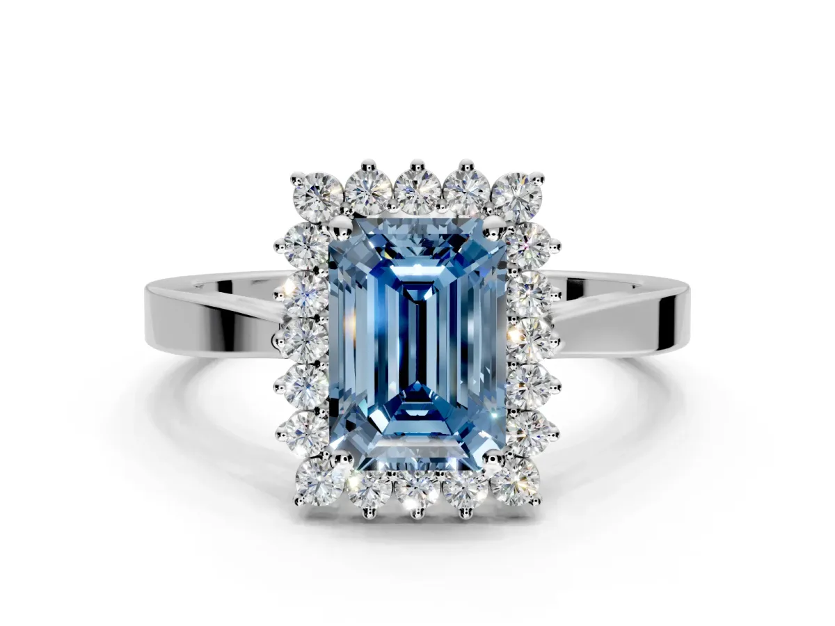 Starburst Halo Engagement Ring Setting for Fancy Blue Emerald Cut Center with Flat Cathedral Band and Prong Head in Platinum