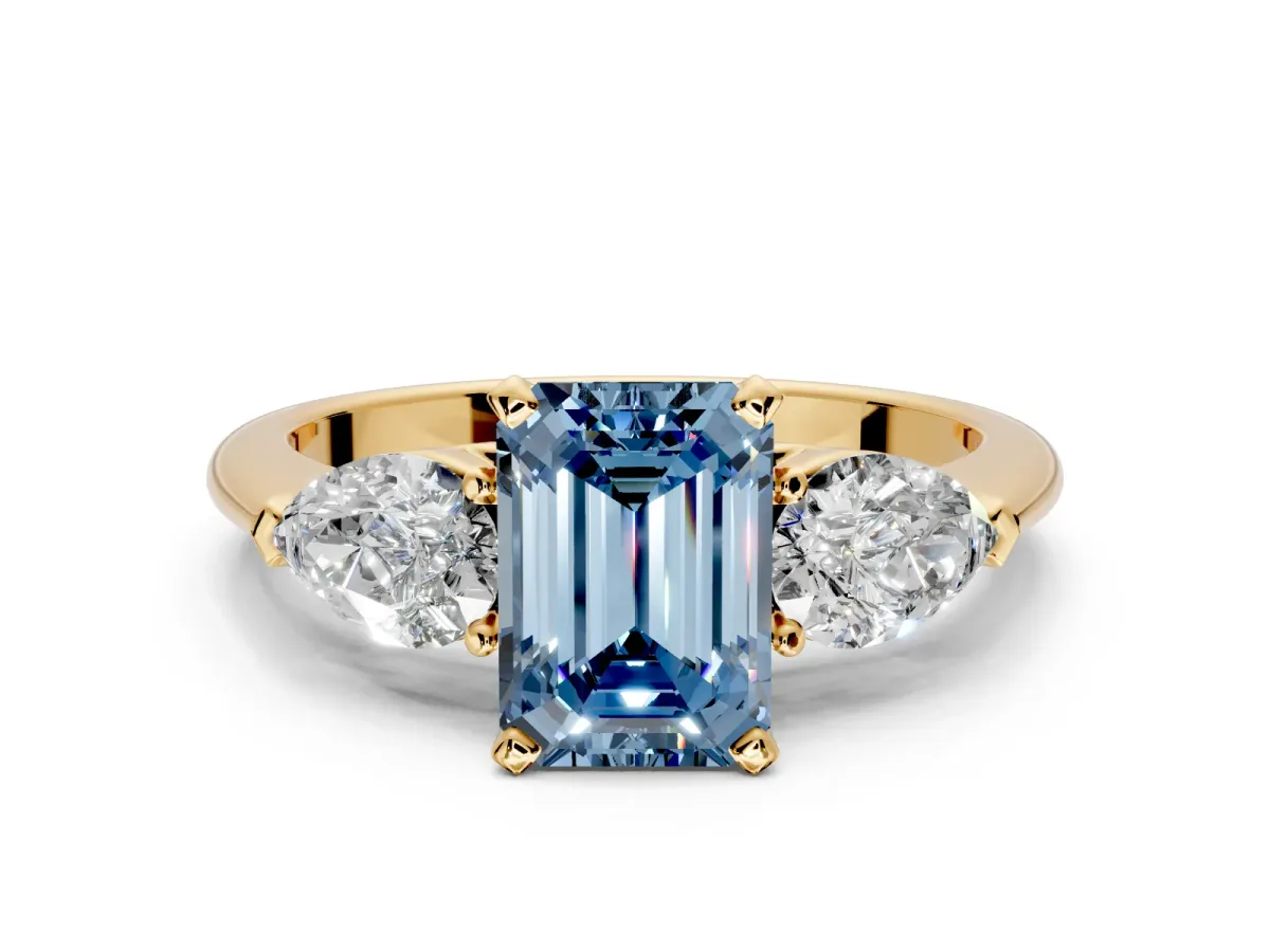 3 Stone Engagement Ring Setting for Fancy Blue Emerald Cut Center with Large Pear-Shaped Accents and Prong Head in Yellow Gold