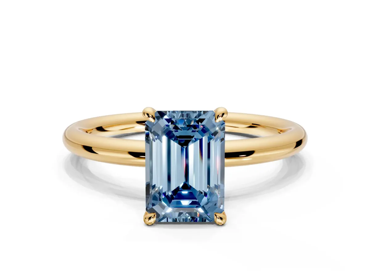 Hidden Halo Engagement Ring Setting for Fancy Blue Emerald Cut Center with Thin Rounded Band and Prong Head in Yellow Gold