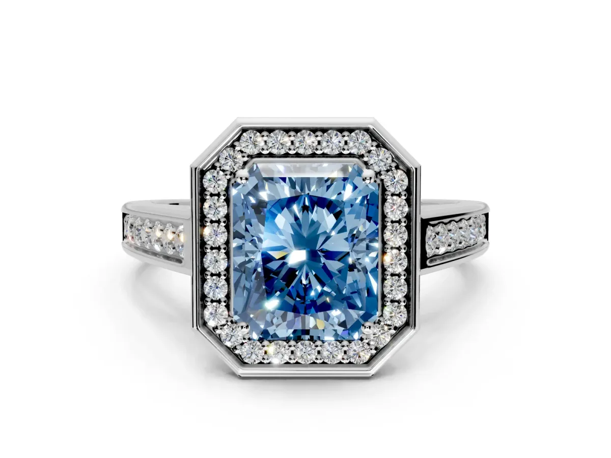 Halo Engagement Ring Setting for Fancy Blue Emerald Cut Center with Outer Bezel Rim, Pave Band and Prong Head in Platinum