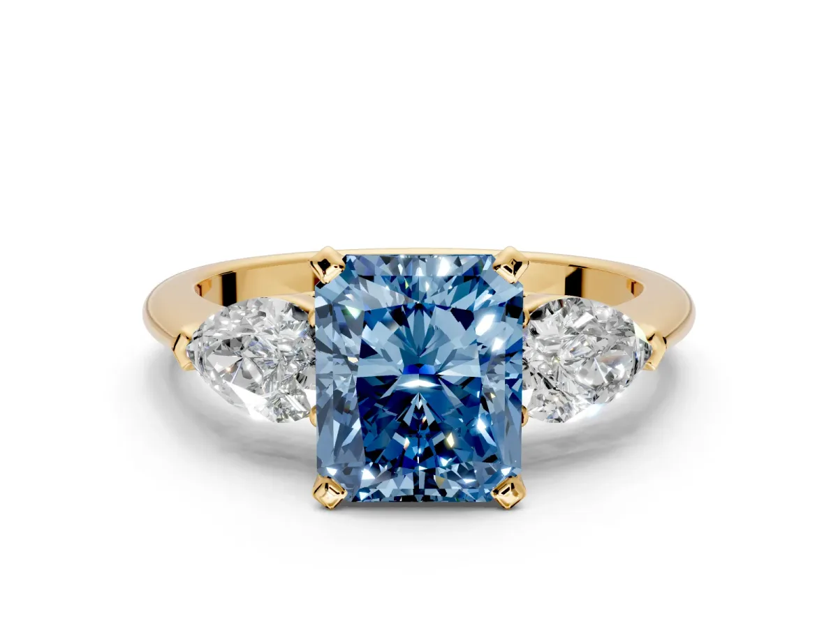 3 Stone Engagement Ring Setting for Fancy Blue Radiant Cut Center with Large Pear-Shaped Accents and Prong Head in Yellow Gold