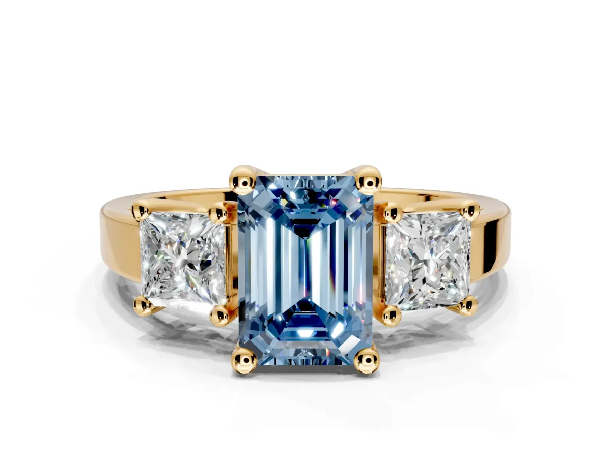 3 Stone Engagement Ring Setting for Fancy Blue Emerald Cut Center with Matching Side Accents and Prong Head in Yellow Gold