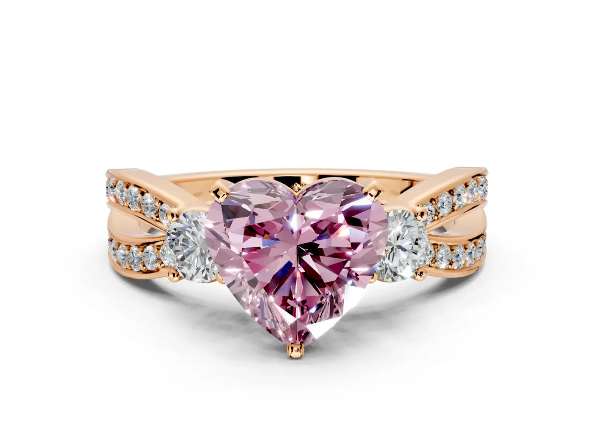 3 Stone Engagement Ring Setting for Fancy Pink Heart-Shaped Center with Pave Twist Band and Prong Head in Rose Gold