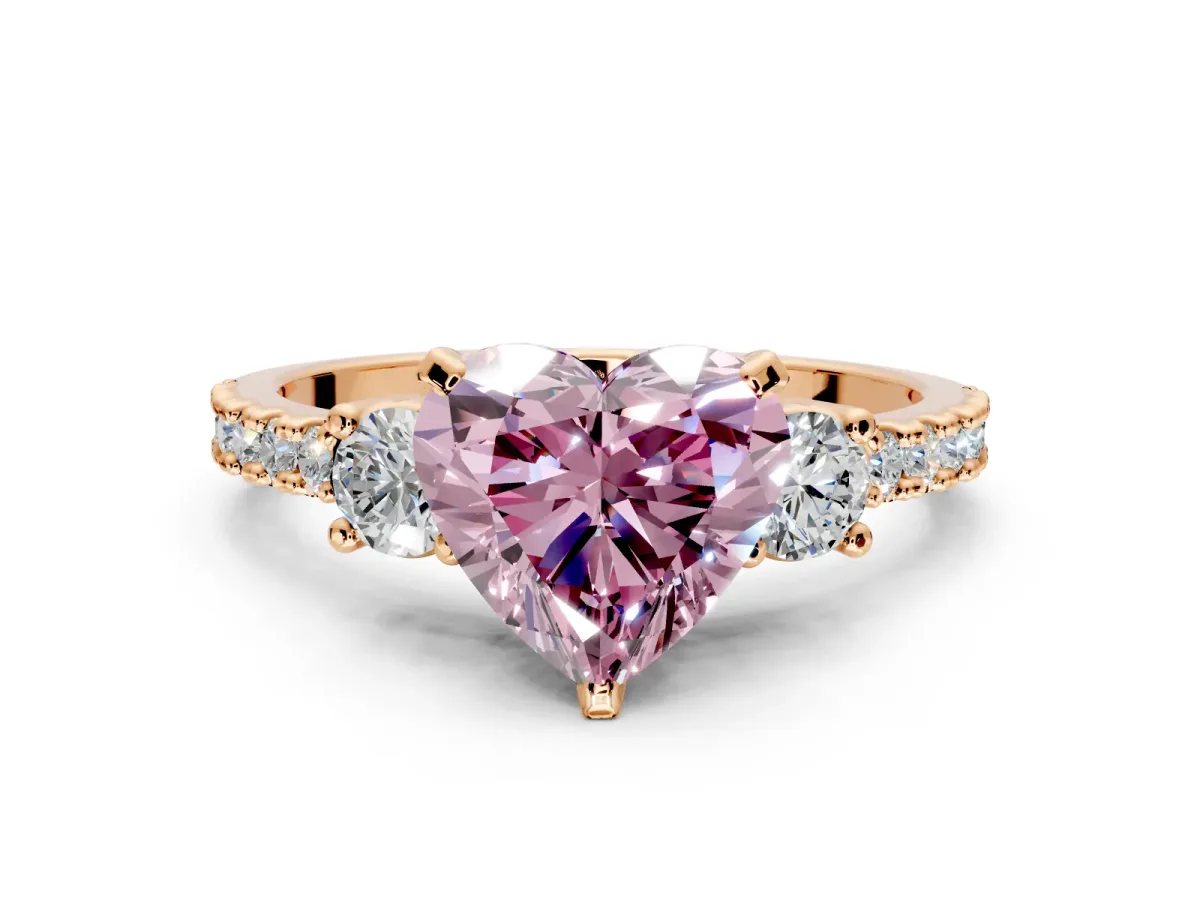 3 Stone Engagement Ring Setting for Fancy Pink Heart-Shaped Center with Round Cut Side Accents and Prong Head in Rose Gold