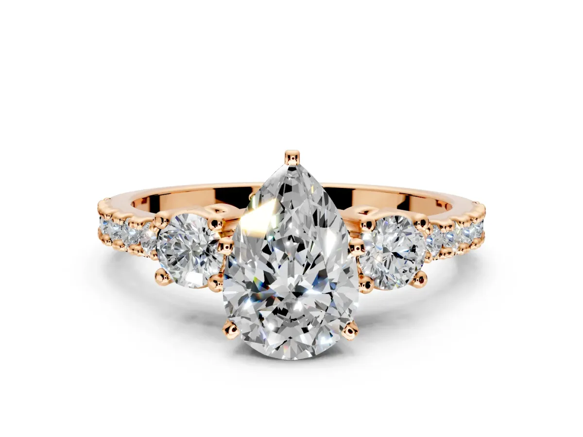 3 Stone Engagement Ring Setting for Pear-Shaped Center with Round Cut Side Accents and Prong Head in Rose Gold