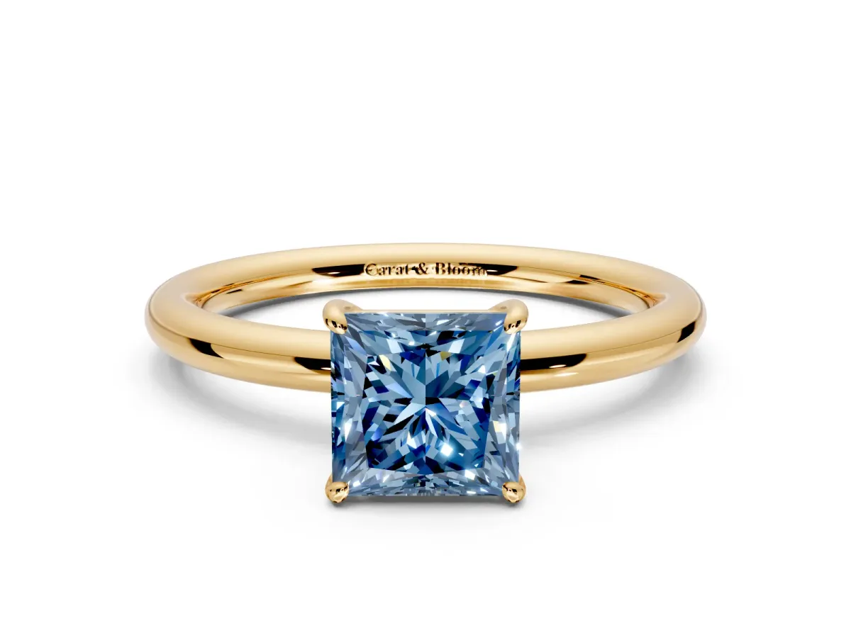 Low-Set Solitaire Engagement Ring Setting for Fancy Blue Princess Cut Center with Thin Plain Band and Prong Head in Yellow Gold