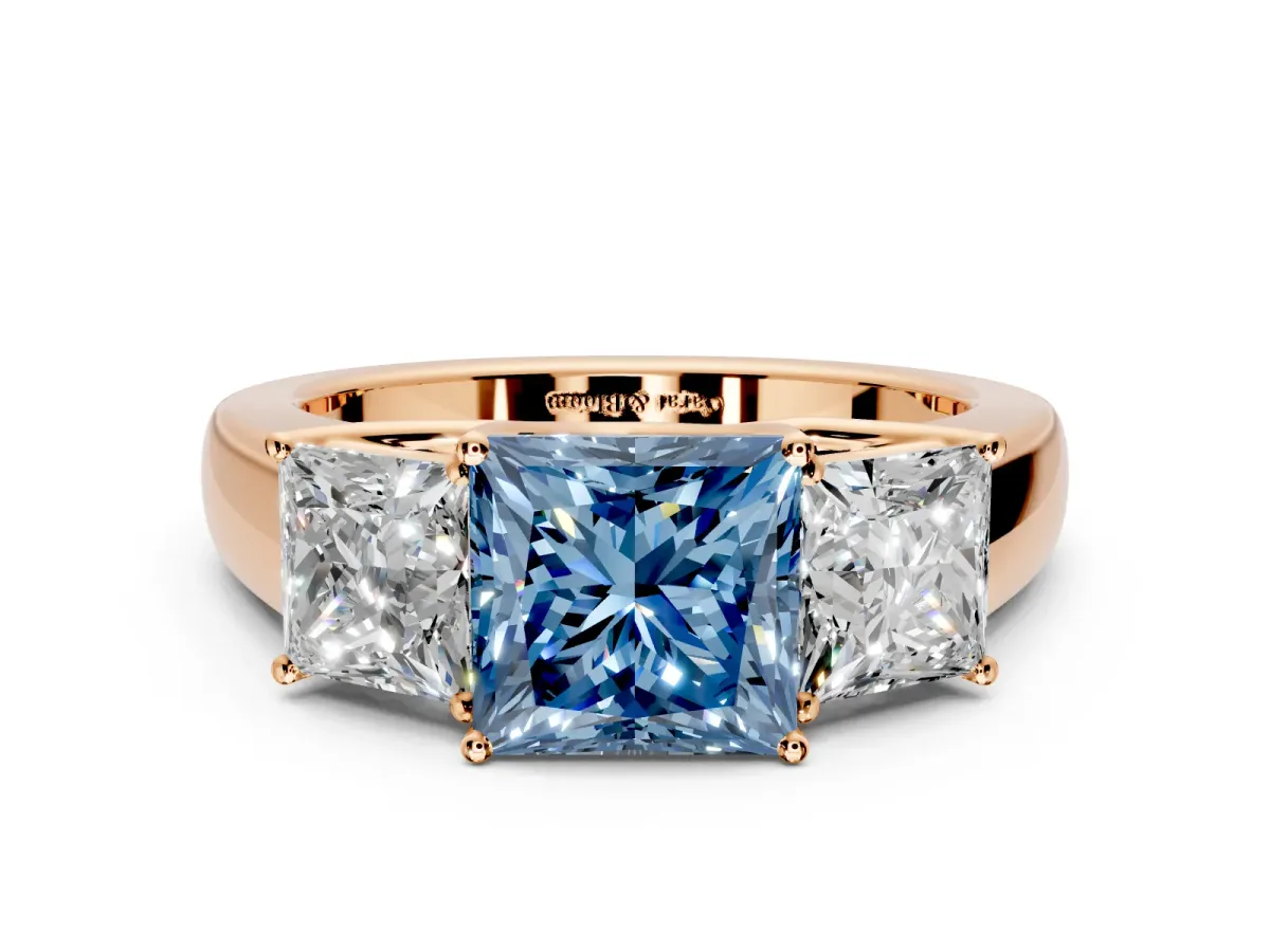 3 Stone Engagement Ring Setting for Fancy Blue Princess Cut Center with Raised Basket Heads and Prong Head in Rose Gold