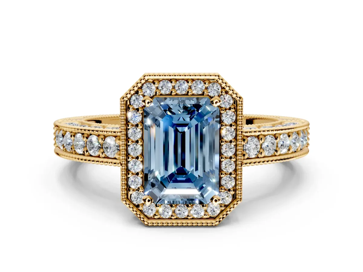 Milgrain Halo Engagement Ring Setting for Fancy Blue Emerald Cut Center with Wide Pave Band and Prong Head in Yellow Gold