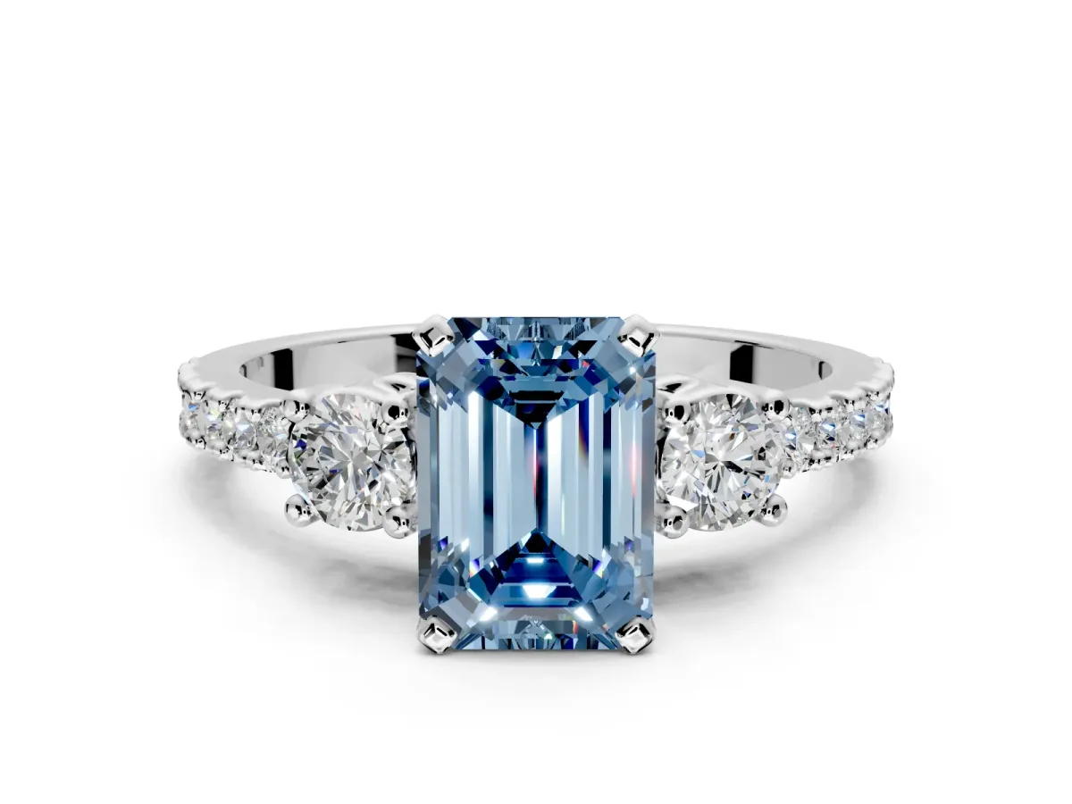3 Stone Engagement Ring Setting for Fancy Blue Emerald Cut Center with Round Cut Side Accents and Prong Head in White Gold
