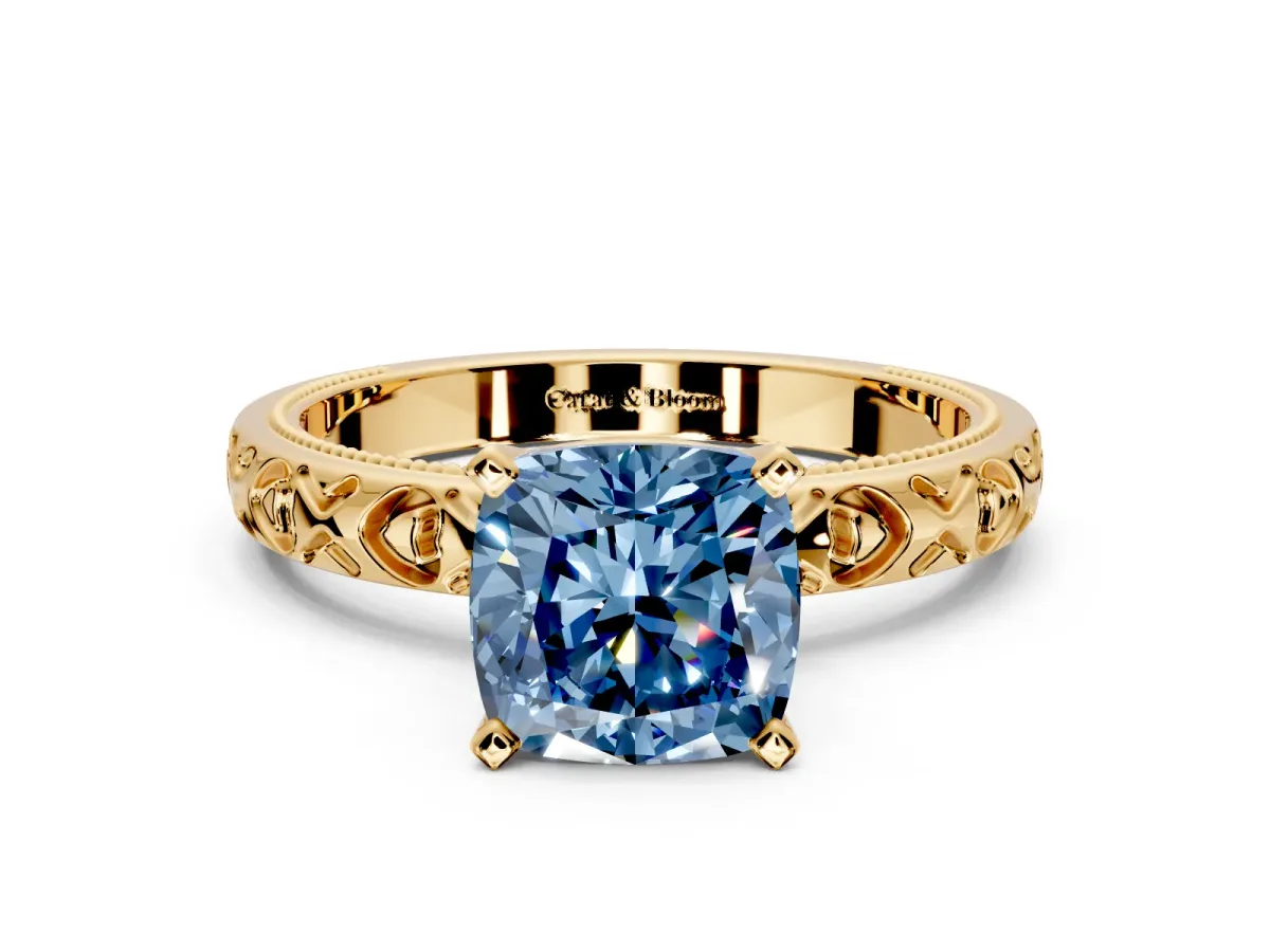 Solitaire Engagement Ring Setting for Fancy Blue Cushion Cut Center with XO Engraved Band and Prong Head in Yellow Gold