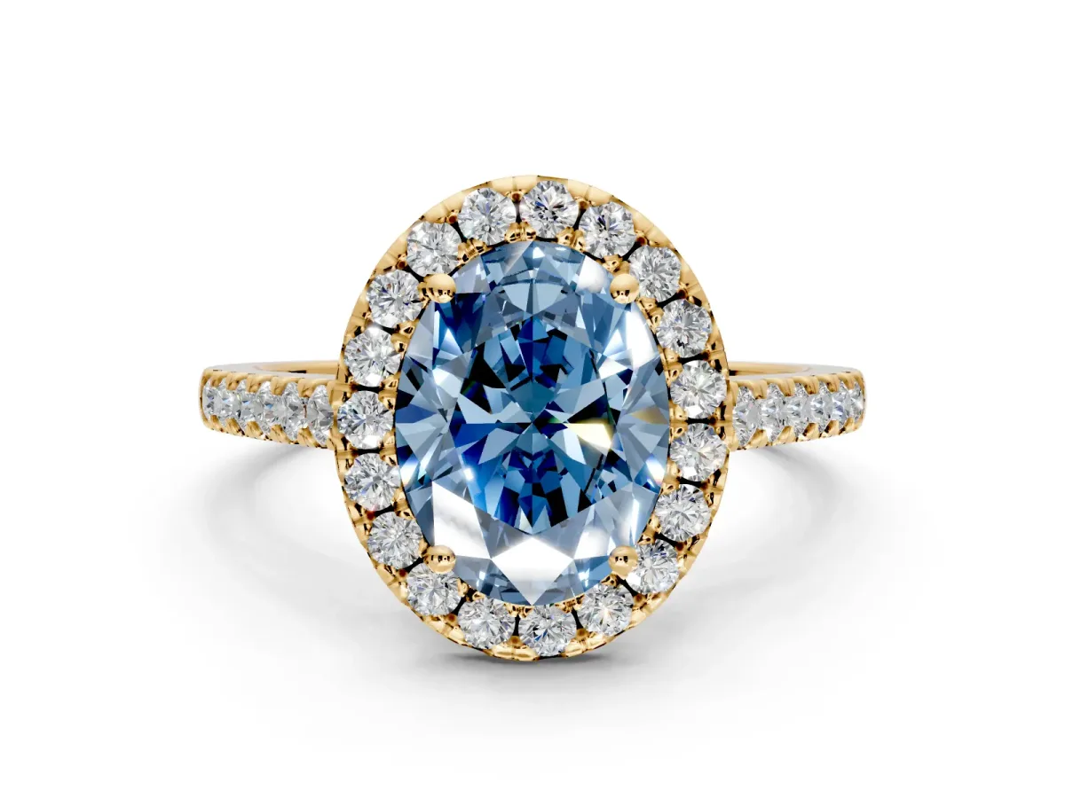 Halo Engagement Ring Setting for Fancy Blue Oval Center with Narrowing Pave Band and Prong Head in Yellow Gold