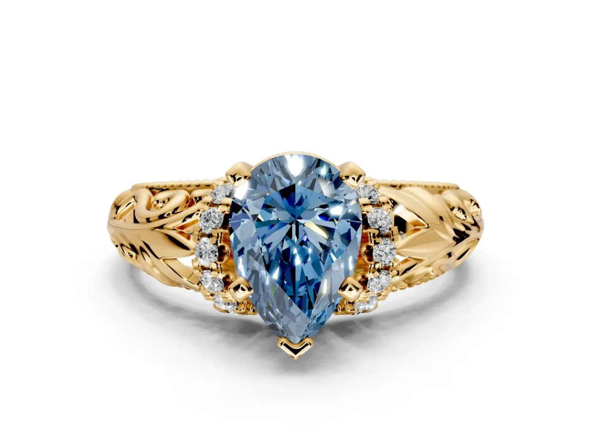 Solitaire Engagement Ring Setting for Fancy Blue Pear-Shaped Center with Filigree Accent Basket and Prong Head in Yellow Gold