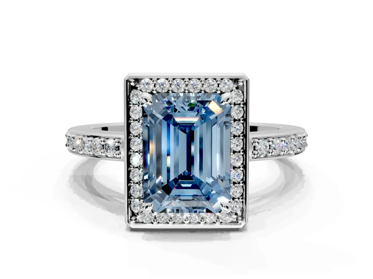 Halo Engagement Ring Setting for Fancy Blue Emerald Cut Center with Metal-Rimmed Halo, Pave Band and Prong Head in Platinum