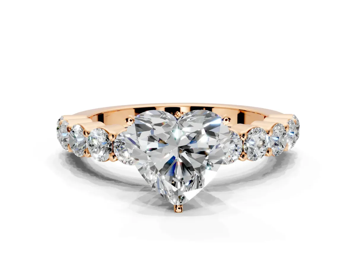 Shared-Prong Engagement Ring Setting for Heart-Shaped Center with Graduated Accents and Prong Head in Rose Gold