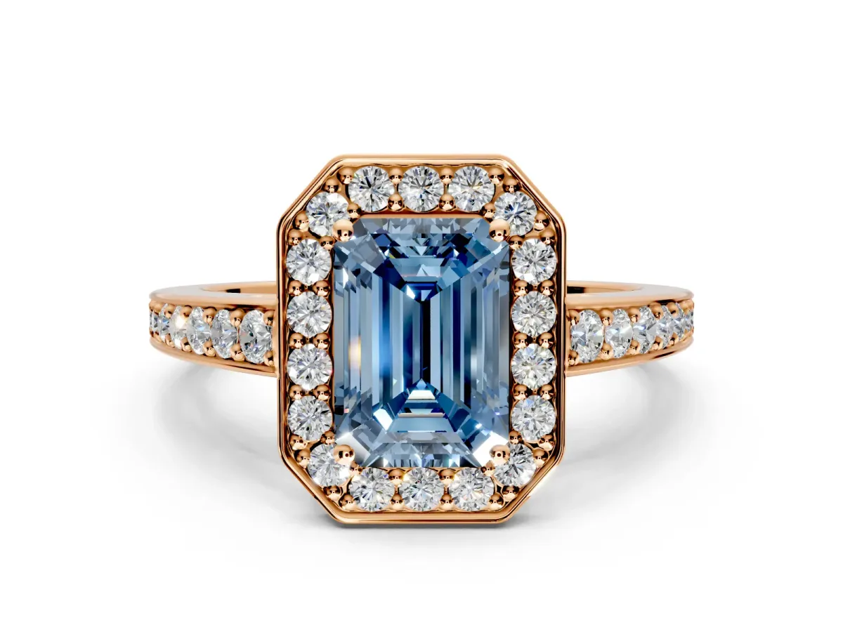 Bezel-Framed Halo Engagement Ring Setting for Fancy Blue Emerald Cut Center with Pave Band and Prong Head in Rose Gold