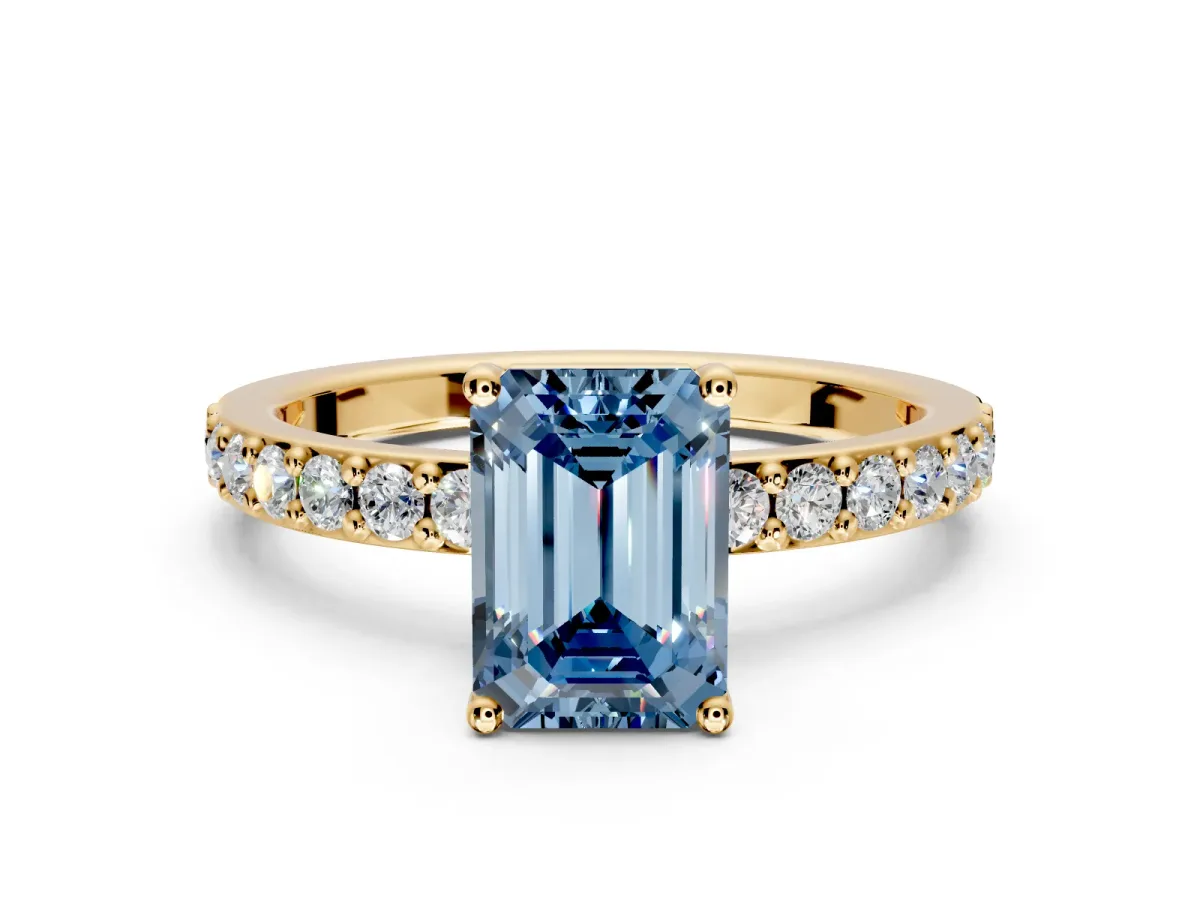 Solitaire Engagement Ring Setting for Fancy Blue Emerald Cut Center with Round Cut Pave Band and Prong Head in Yellow Gold