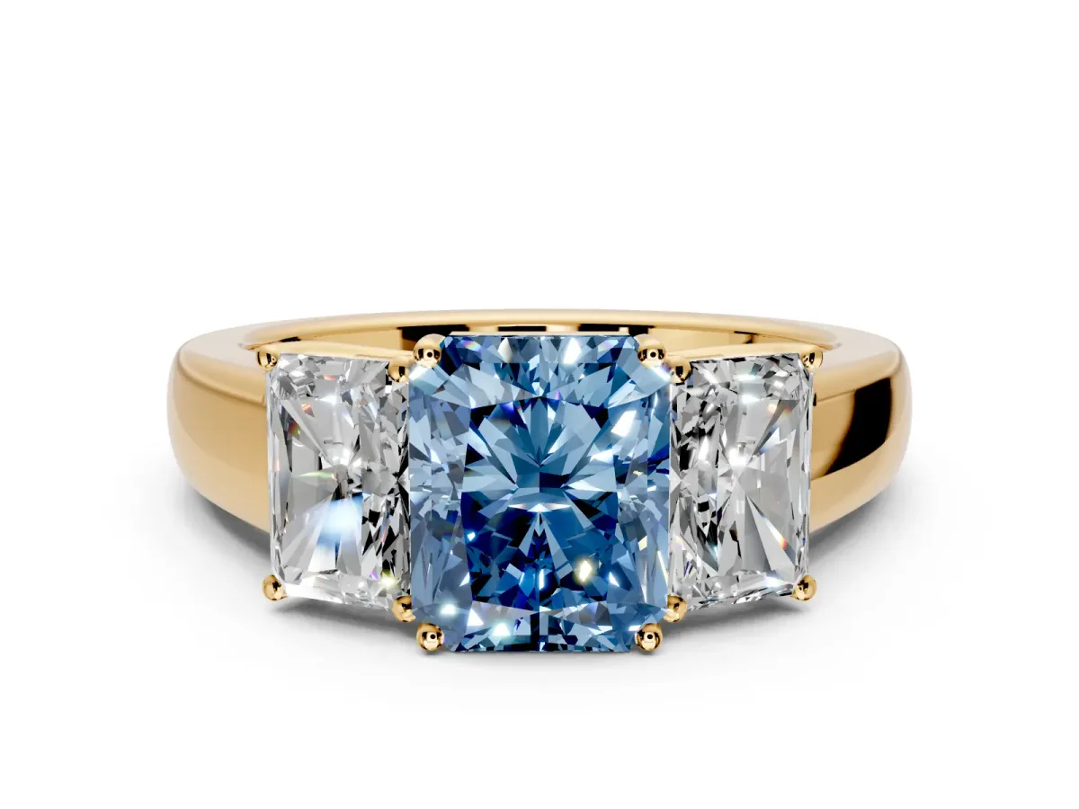 3 Stone Engagement Ring Setting for Fancy Blue Radiant Cut Center with Raised Basket Heads and Prong Head in Yellow Gold