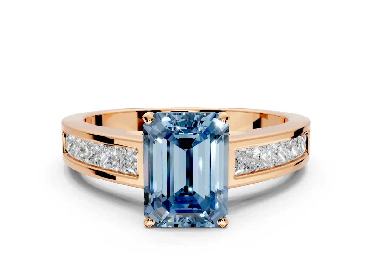 Solitaire Engagement Ring Setting for Fancy Blue Emerald Cut Center with Princess Cut Channel Band and Prong Head in Rose Gold