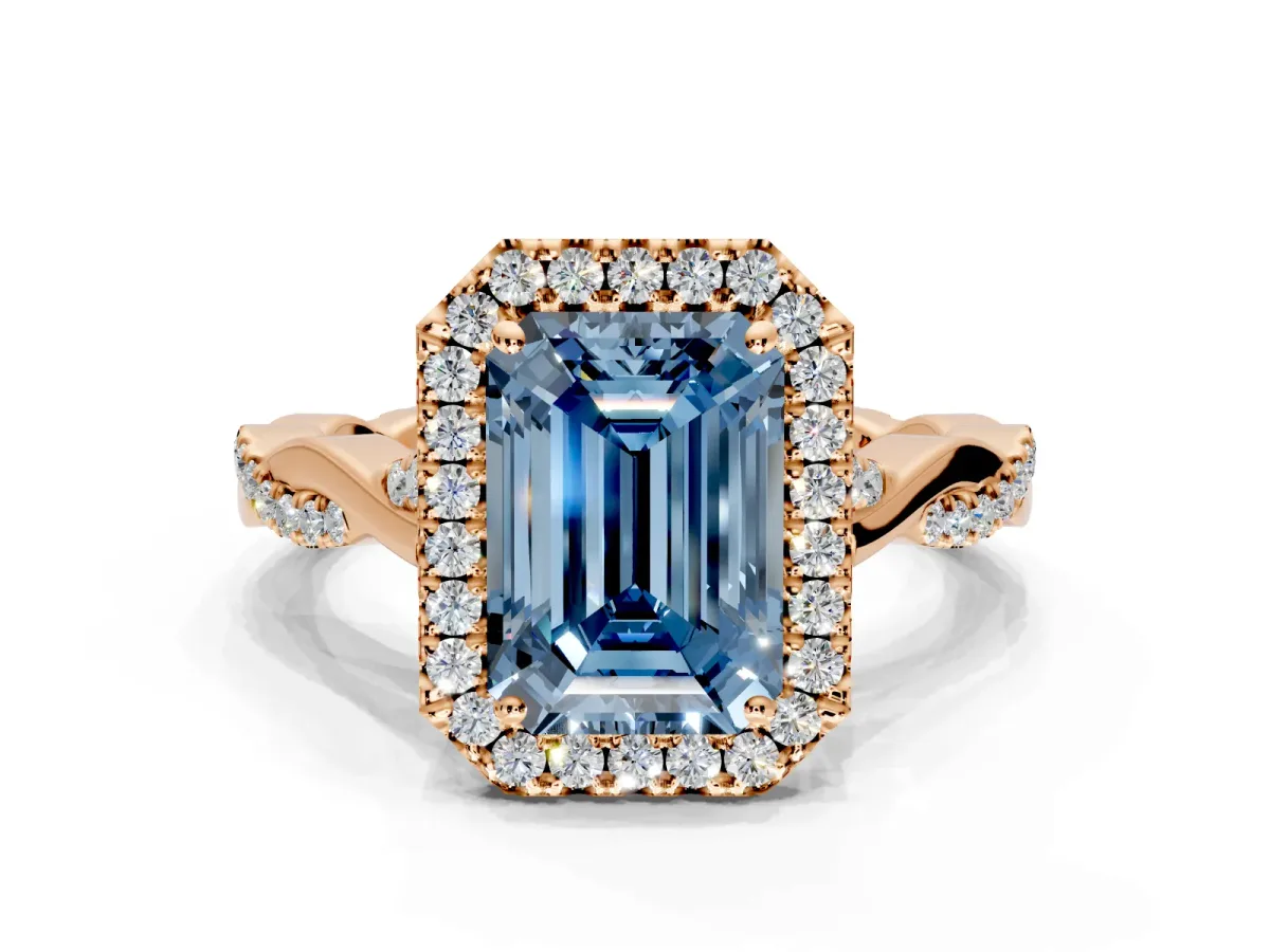 Halo Engagement Ring Setting for Fancy Blue Emerald Cut Center with Twist Band and Prong Head in Rose Gold