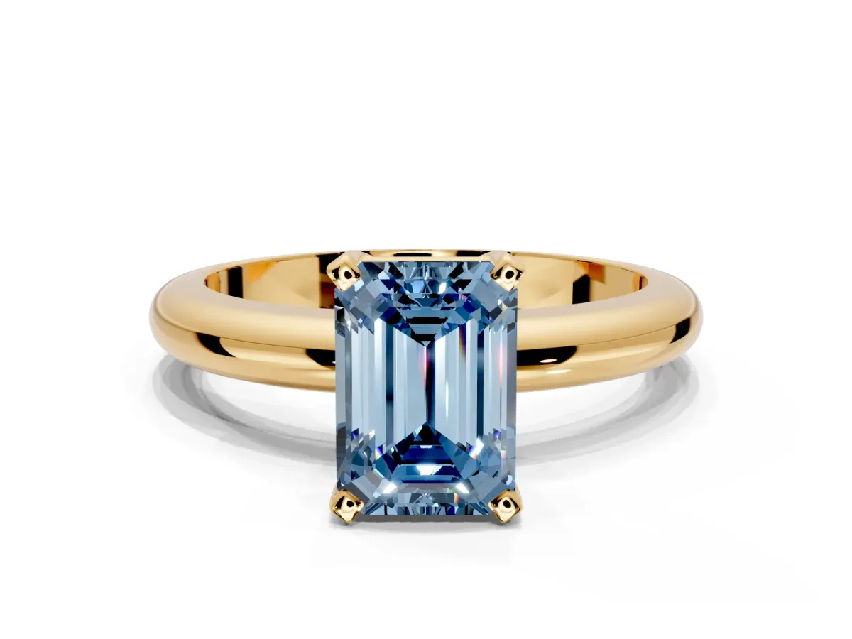 Solitaire Engagement Ring Setting for Fancy Blue Emerald Cut Center with Wire Band and Prong Head in Yellow Gold