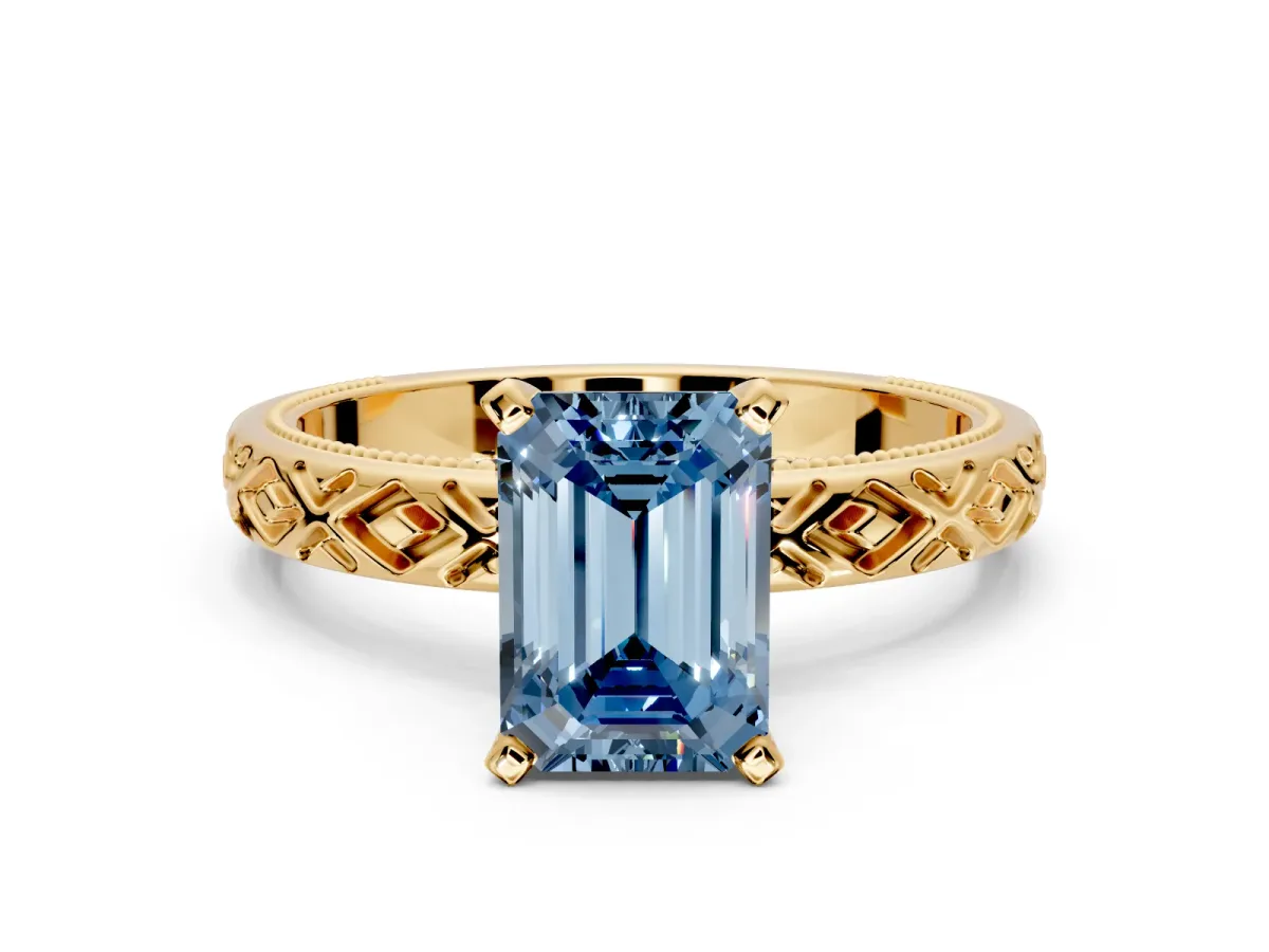 Solitaire Engagement Ring Setting for Fancy Blue Emerald Cut Center with Milgrain X Pattern Band and Prong Head in Yellow Gold