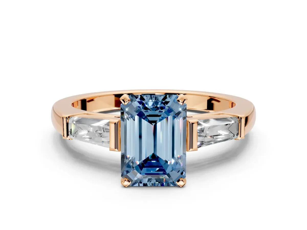 3 Stone Engagement Ring Setting for Fancy Blue Emerald Cut Center with Tapered Baguettes, Plain Band and Prong Head in Rose Gold
