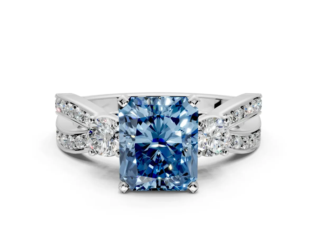 3 Stone Engagement Ring Setting for Fancy Blue Radiant Cut Center with Pave Twist Band and Prong Head in Platinum