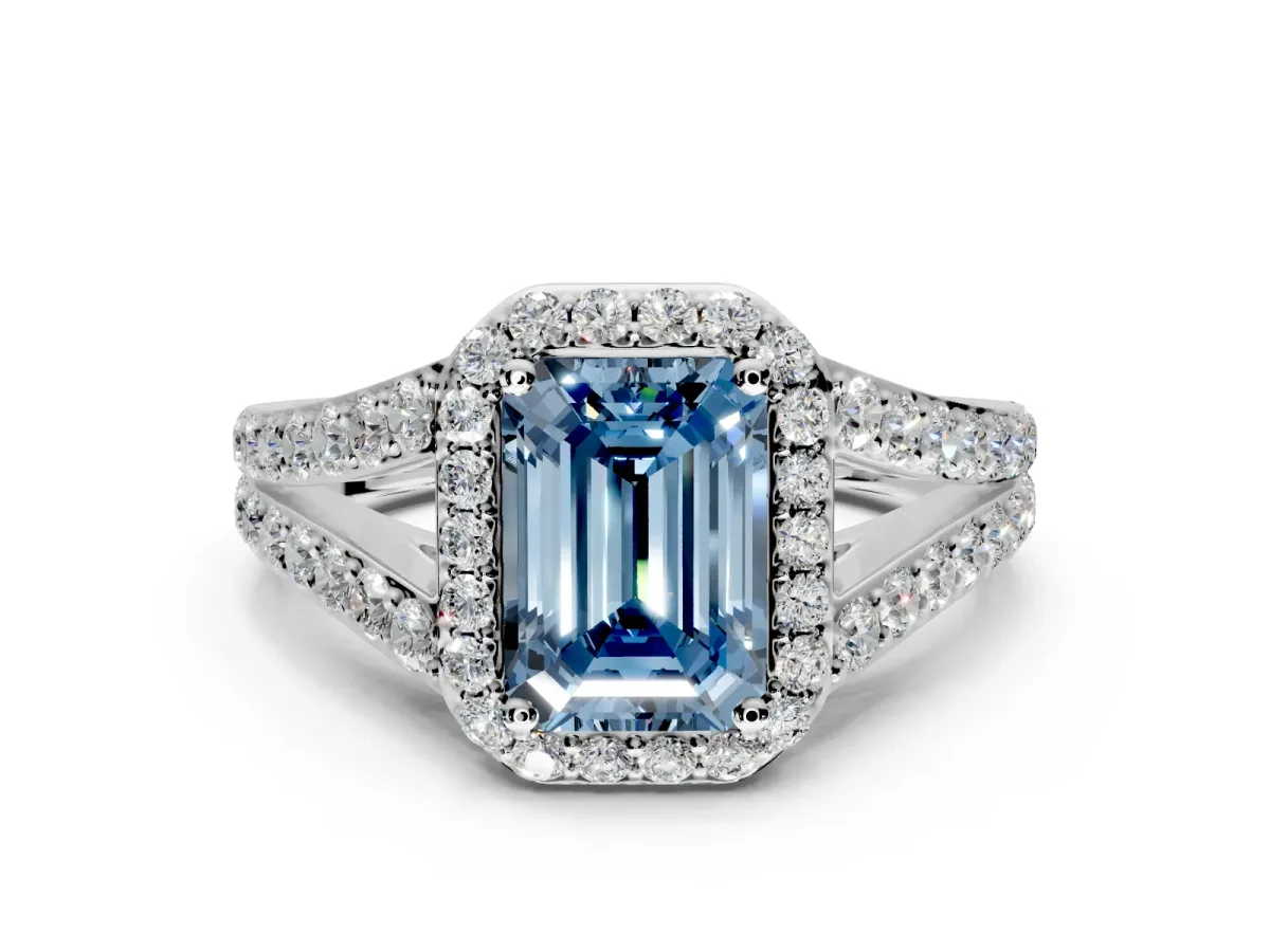 Halo Engagement Ring Setting for Fancy Blue Emerald Cut Center with Narrow Pave Split Shank and Prong Head in Platinum
