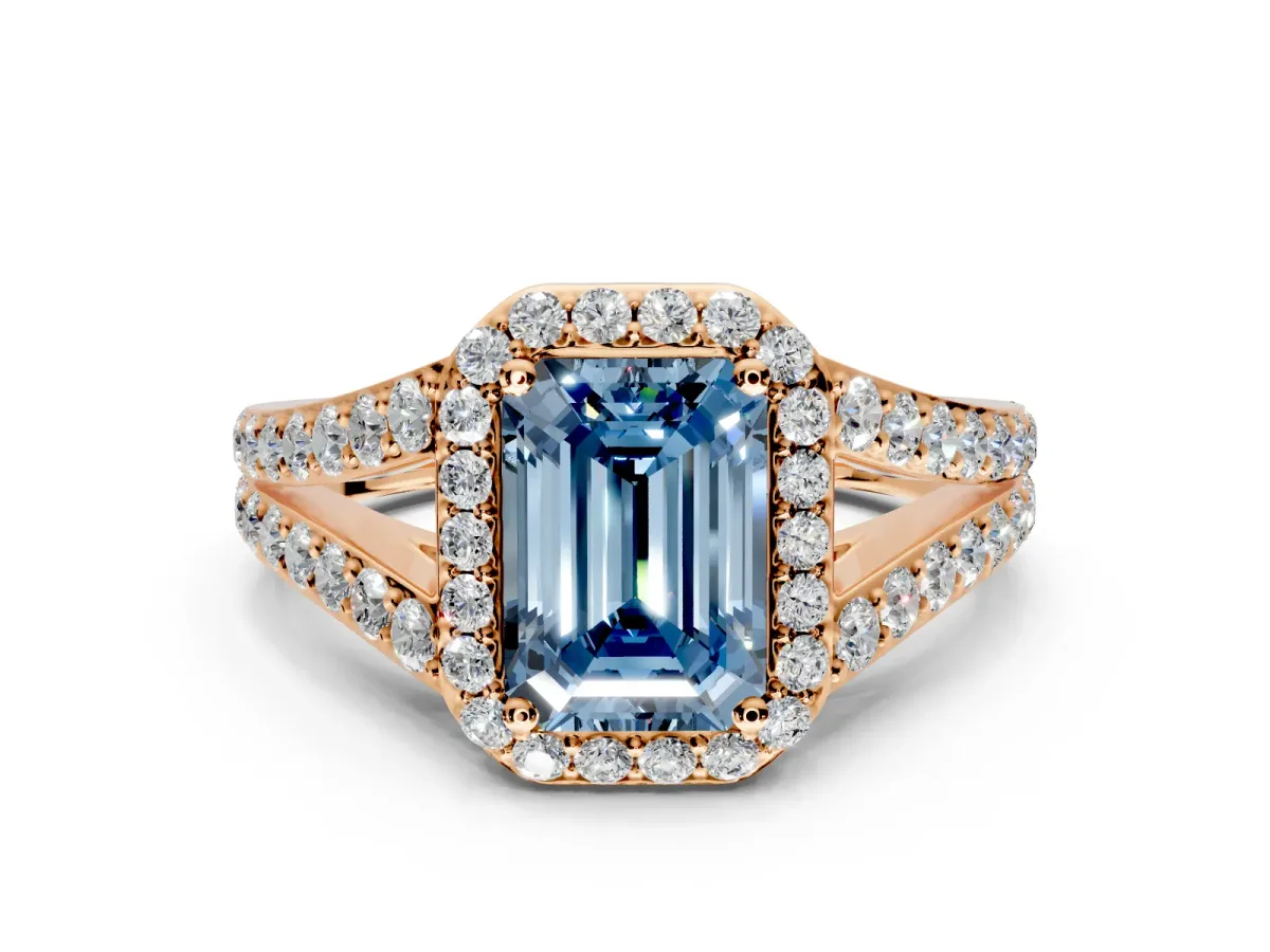 Halo Engagement Ring Setting for Fancy Blue Emerald Cut Center with Narrow Pave Split Shank and Prong Head in Rose Gold