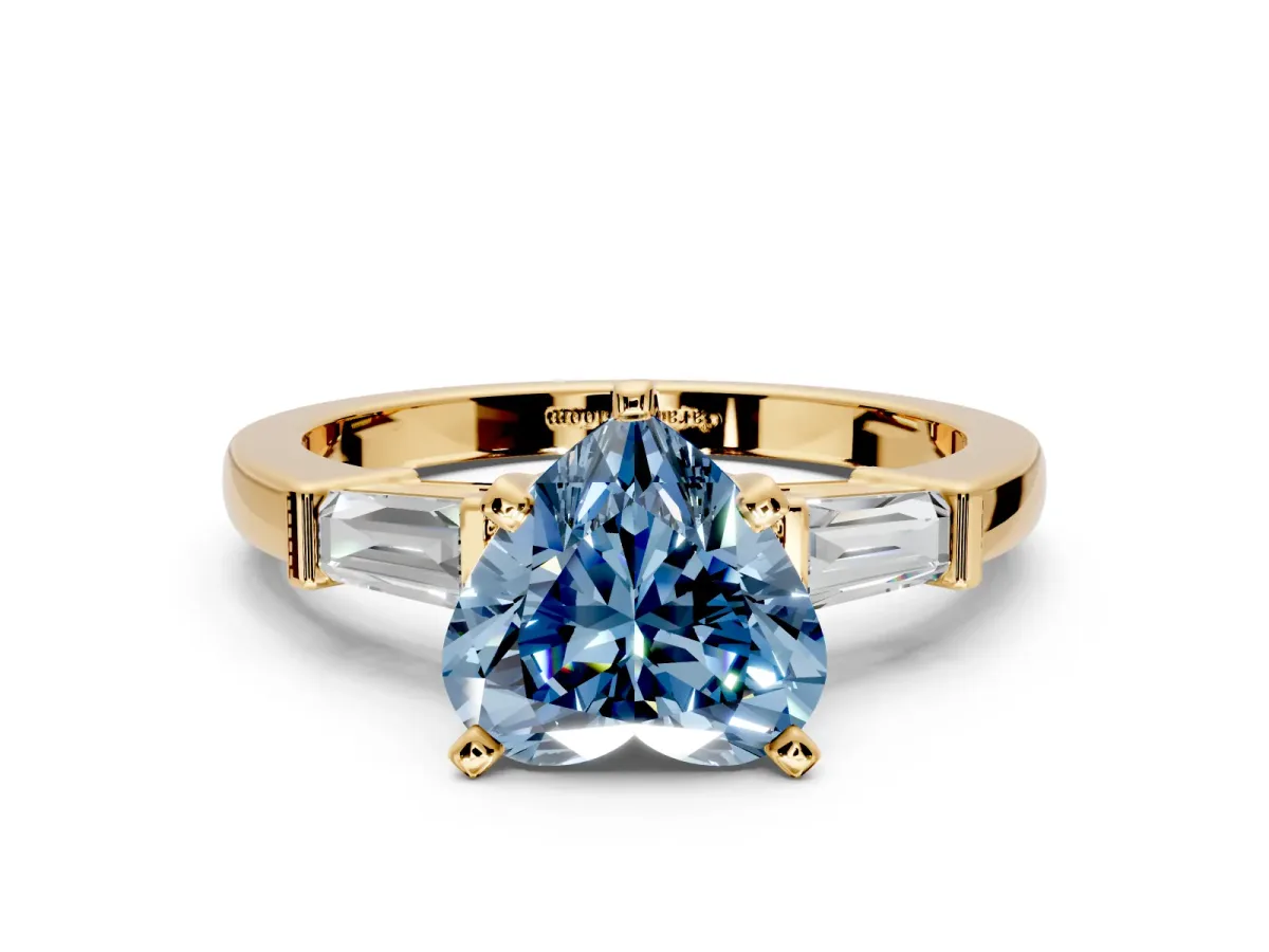 3 Stone Engagement Ring Setting for Fancy Blue Heart-Shaped Center with Channel Baguette Accents and Prong Head in Yellow Gold